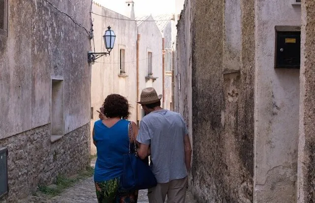 couple walking europe retired